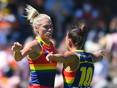 Adelaide Crows player Erin Phillips celebrates a goal with teammate Ebony Marinoff