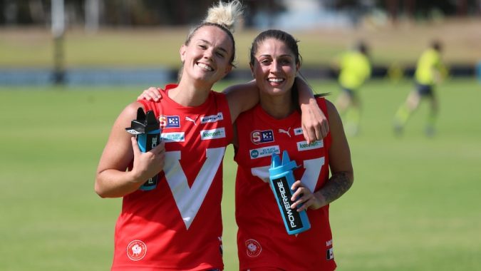 Broken Hill girls Rebecca Deer and Hannah Muscat smiling and posing for a photo after a SANFLW development game