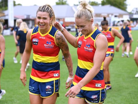 Erin Phillips puts her hand on Anne Hatchard's shoulder as the two leave Norwood Oval