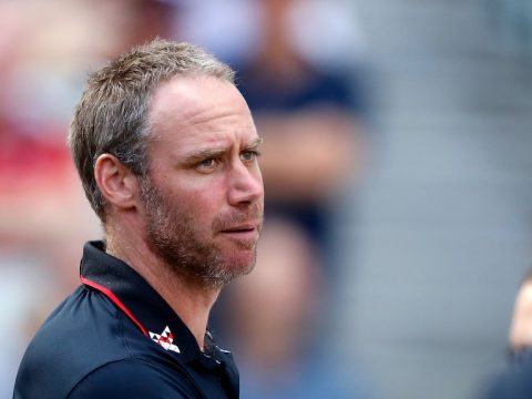 Essendon coach Ben Rutten looks dejected during a game against Geelong