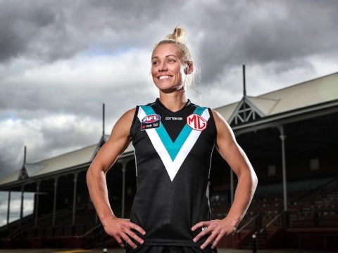Erin Phillips smiles, pictured in a Port Adelaide jumper at Alberton Oval