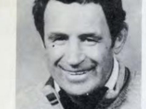 A black and white head shot of John Coogan