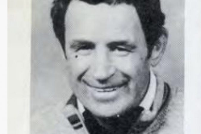A black and white head shot of John Coogan