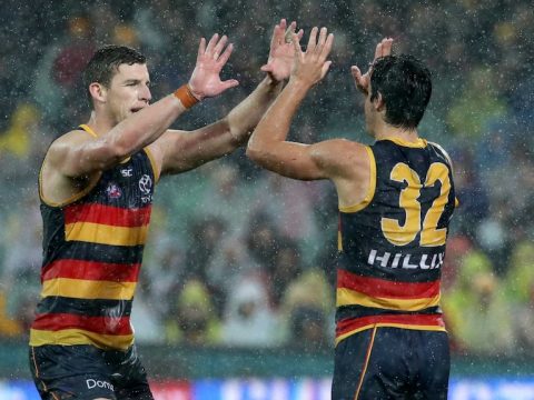 Josh Jenkins and Darcy Fogarty give each other a high five during the Crows' encounter against the Bulldogs.