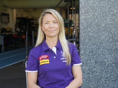 Angie Bain, Fremantle Dockers' Head of Wellbeing, sitting outside the Dockers gym at Cockburn ARC