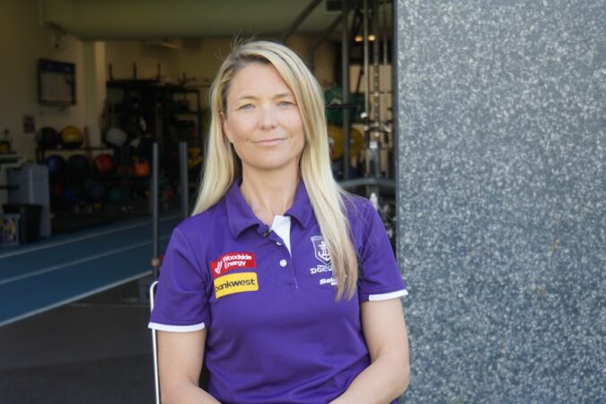 Angie Bain, Fremantle Dockers' Head of Wellbeing, sitting outside the Dockers gym at Cockburn ARC