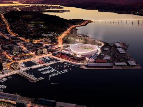 In this concept image, a stadium shines brightly in Hobart under an pink evening sky.