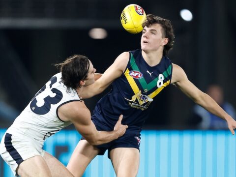 Archie Roberts is tackled while playing for the AFL Academy